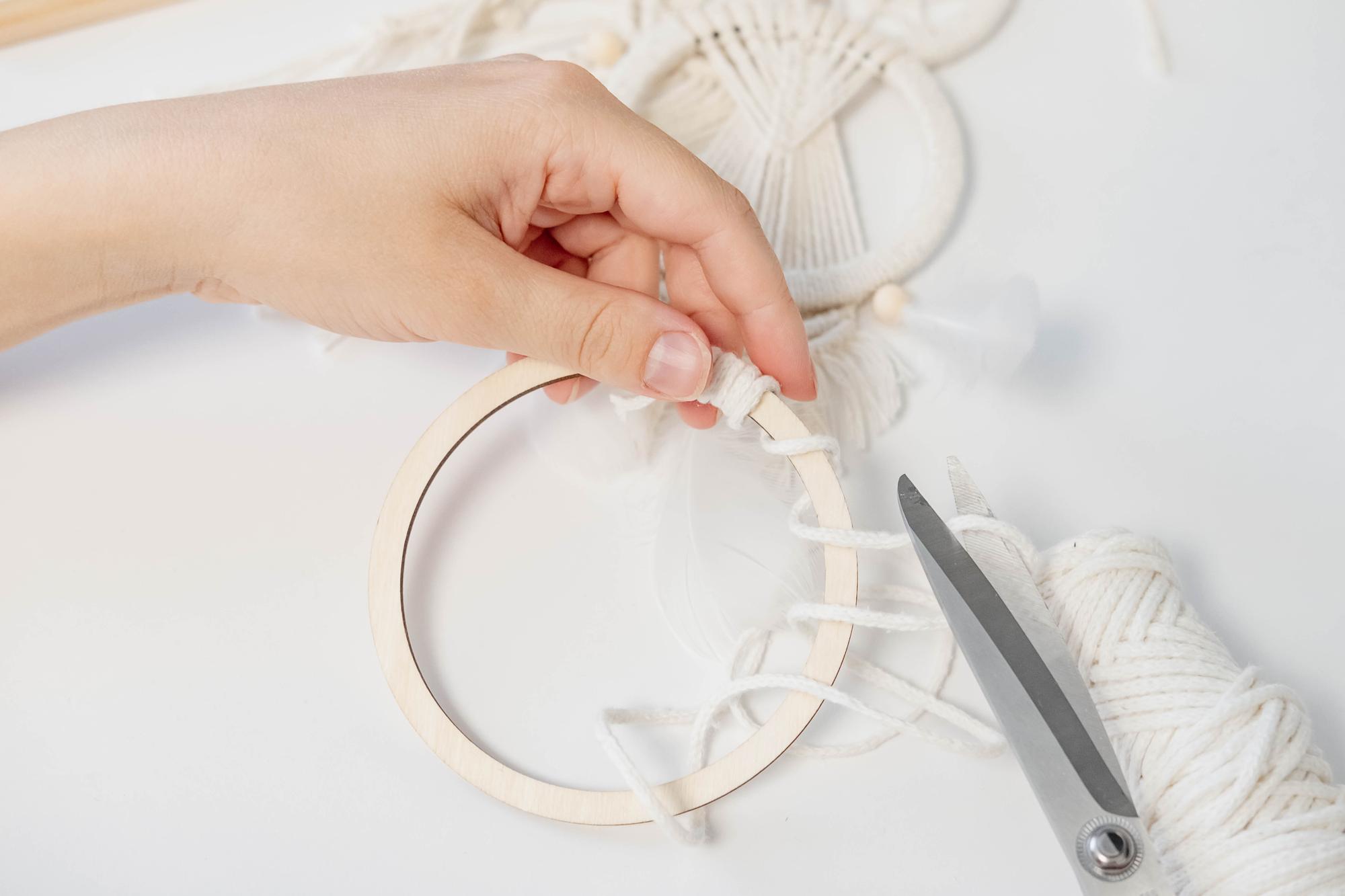 studio hands working on hoop embroidery