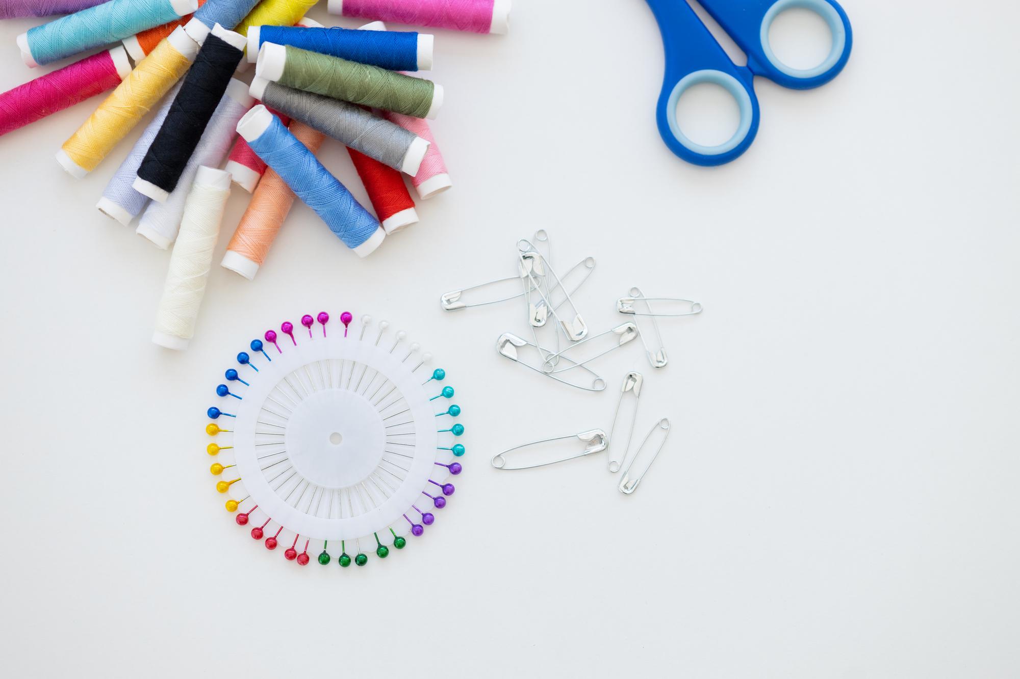 flat lay of embroidery tools and sample swatches